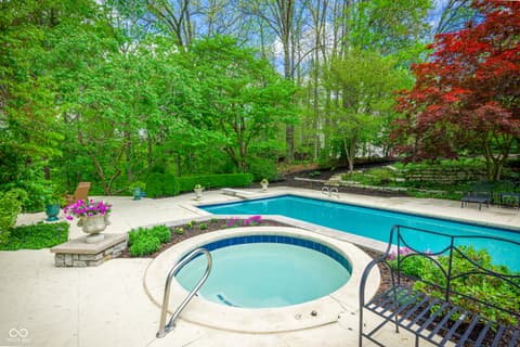 Pool at 7436 Glenvista Place, Fishers, IN — Luxurious pool and spa oasis nestled in mature landscaping.