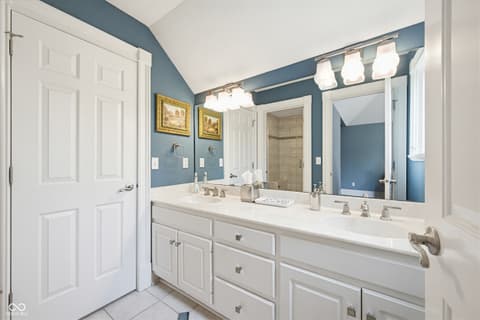 Primary bathroom at 7436 Glenvista Place, Fishers, IN — Spacious primary bath with dual vanity and walk-in shower.