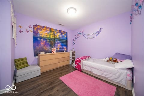 Bedroom at 14128 Stoney Shore Avenue, McCordsville, IN — Bright, freshly updated bedroom with hardwood floors.