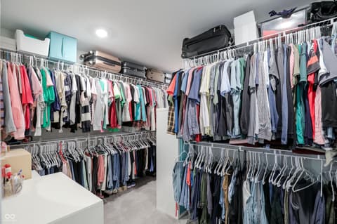 Bonus room at 17462 Cavalcade Circle, Noblesville, IN — Luxurious walk-in closet with dual hanging rods.