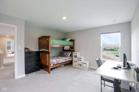 Bedroom at 17462 Cavalcade Circle, Noblesville, IN — Spacious bedroom with bunk beds and dedicated work area.