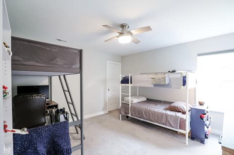 Bedroom at 17462 Cavalcade Circle, Noblesville, IN — Spacious bedroom with dual bunk beds and excellent storage.