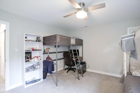 Bedroom at 17462 Cavalcade Circle, Noblesville, IN — Spacious bedroom with integrated loft bed and workspace.