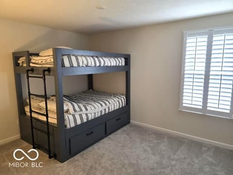Bedroom at 852 Cowley Drive, Westfield, IN — Spacious bedroom with built-in bunk beds and storage.