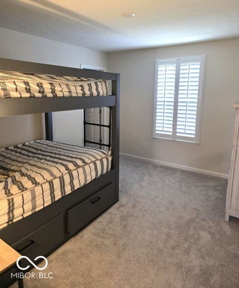 Bedroom at 852 Cowley Drive, Westfield, IN — Spacious bedroom with built-in bunk beds and storage.
