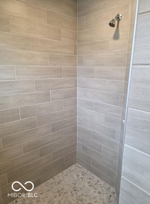 Primary bathroom at 852 Cowley Drive, Westfield, IN — Spa-like walk-in shower with modern tile finishes.