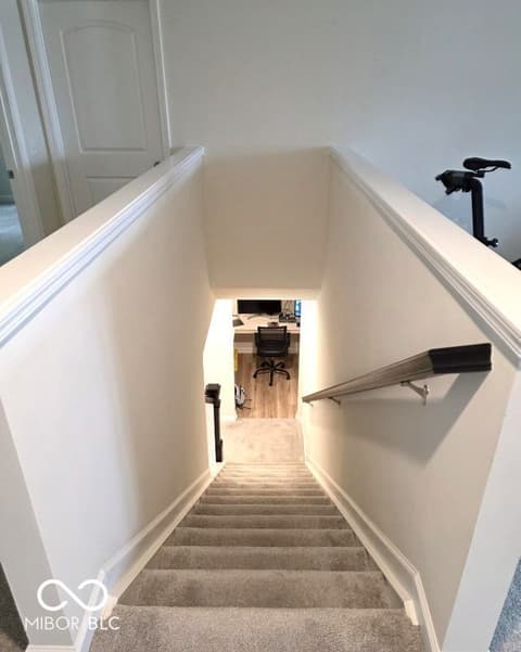 Hallway at 852 Cowley Drive, Westfield, IN — Bright, clean stairwell with modern handrail and trim.