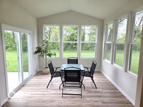 Outdoor living area at 852 Cowley Drive, Westfield, IN — Bright sunroom with expansive windows and yard views.