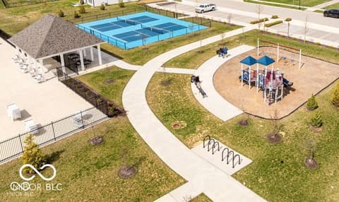 Aerial view at 852 Cowley Drive, Westfield, IN — New community amenities with tennis courts and playground.
