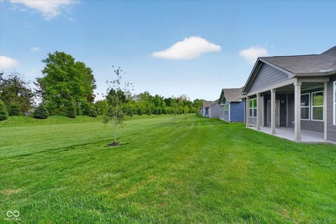 Backyard at 20237 Willenhall Court, Westfield, IN — Modern home with covered patio and expansive backyard.