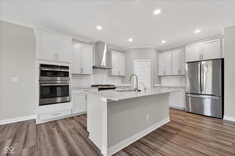 Kitchen at 20237 Willenhall Court, Westfield, IN — Modern kitchen with stainless appliances and island.