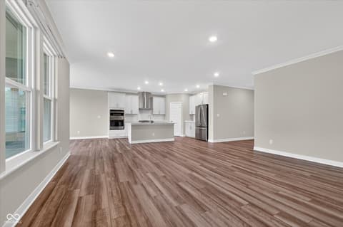 Living room at 20237 Willenhall Court, Westfield, IN — Bright open living space with fireplace and hardwood floors.