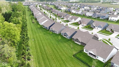 Aerial view at 20237 Willenhall Court, Westfield, IN — New construction homes with scenic river and pastoral views.