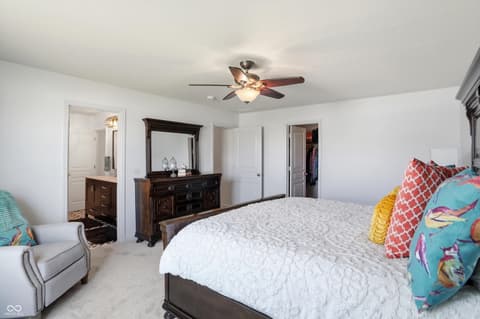 Primary bedroom at 14680 Hinton Drive, Fishers, IN — Spacious primary bedroom with ensuite and walk-in closet.