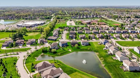 Aerial view at 14680 Hinton Drive, Fishers, IN — Established community with scenic pond and lush grounds.