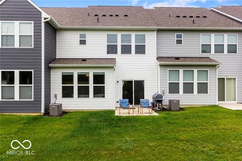 Backyard at 14350 Ludwell Court, Fishers, IN — Spacious backyard with composite deck and mature lawn.