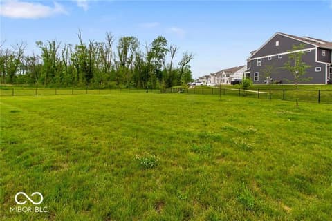 Yard at 14350 Ludwell Court, Fishers, IN — Large fenced yard with mature trees and open space.