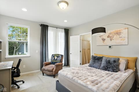 Primary bedroom at 13311 Susser Way, Fishers, IN — Bright primary suite with updated finishes and workspace.