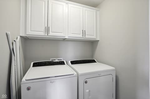 Laundry room at 13311 Susser Way, Fishers, IN — Bright, updated laundry room with ample storage cabinetry.