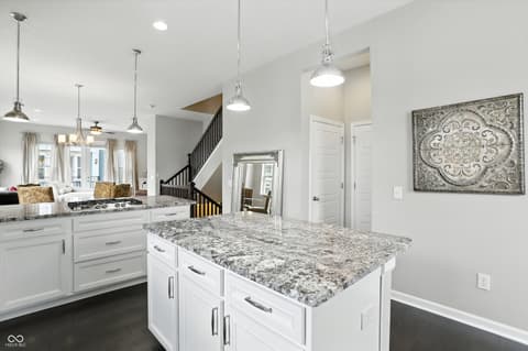 Kitchen at 13311 Susser Way, Fishers, IN — Stunning modern kitchen with granite island and open layout.