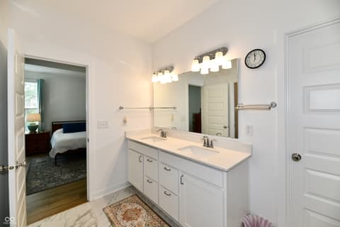 Primary bathroom at 19406 Honeylocust Glen, Noblesville, IN — Spacious primary bath with dual vanity and ample lighting.