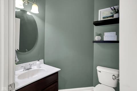 Bathroom at 10587 Proposal Pointe Way, Fishers, IN — Freshly renovated bathroom with sage green accent walls.