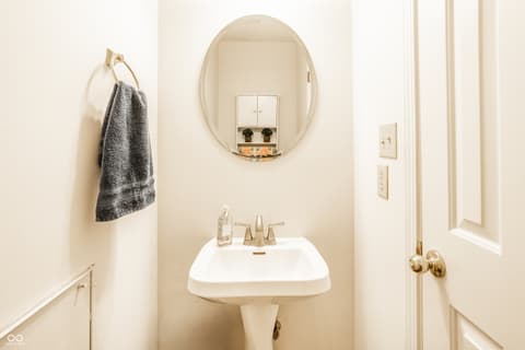 Primary bathroom at 9845 Worthington Boulevard, Fishers, IN — Bright, updated bathroom with modern fixtures and storage.
