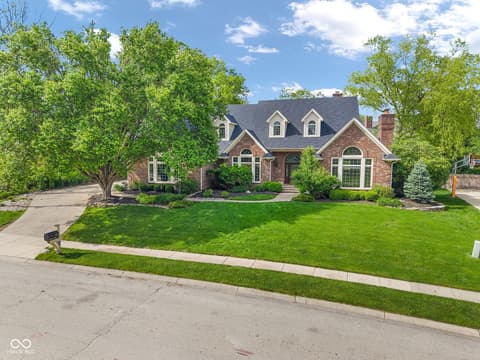 Front exterior at 3172 Smokey Ridge Lane, Carmel, IN — Well-maintained brick colonial with mature landscaping.
