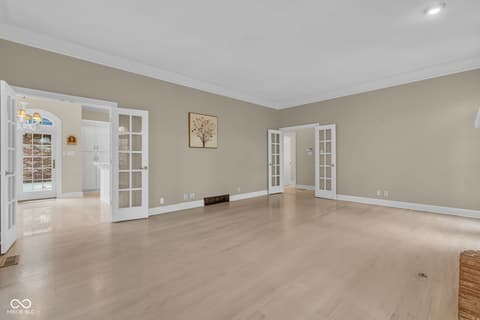 Family room at 3172 Smokey Ridge Lane, Carmel, IN — Spacious family room with elegant hardwood floors.