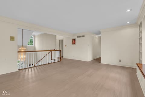 Bonus room at 3172 Smokey Ridge Lane, Carmel, IN — Spacious bonus room with hardwood floors and natural light.