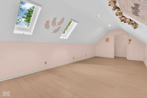 Bonus room at 3172 Smokey Ridge Lane, Carmel, IN — Bright bonus room with skylights and vaulted ceilings.