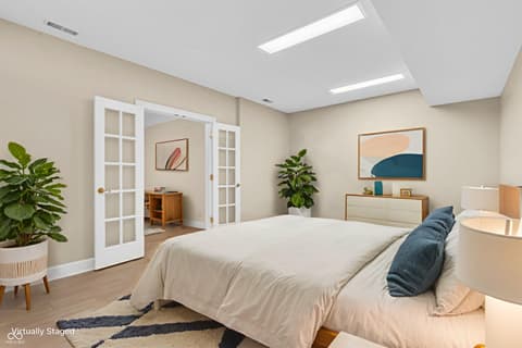 Primary bedroom at 3172 Smokey Ridge Lane, Carmel, IN — Bright primary bedroom with ensuite and modern staging.