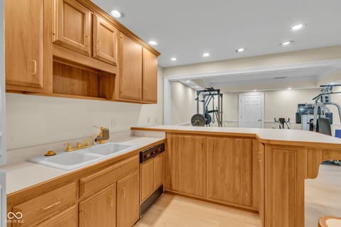 Kitchen at 3172 Smokey Ridge Lane, Carmel, IN — Spacious kitchen with premium wood cabinetry and island.