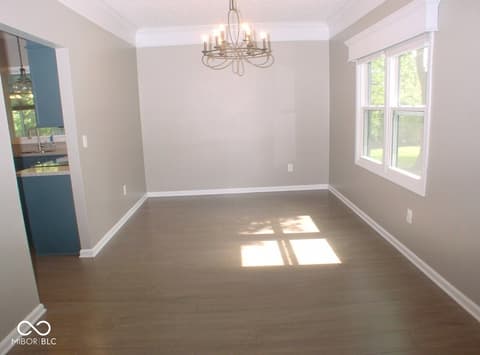 Dining room at 7623 Willow Ridge, Fishers, IN — Bright dining space with hardwood floors and natural light.