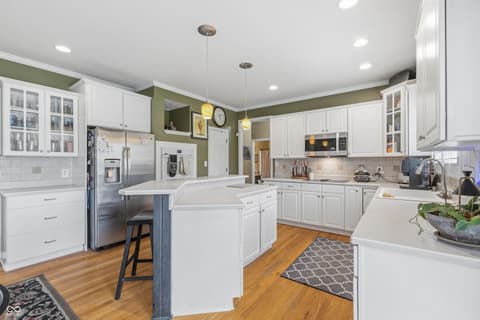 Kitchen at 13221 Griffin Run, Carmel, IN — Spacious renovated kitchen with island and modern finishes.
