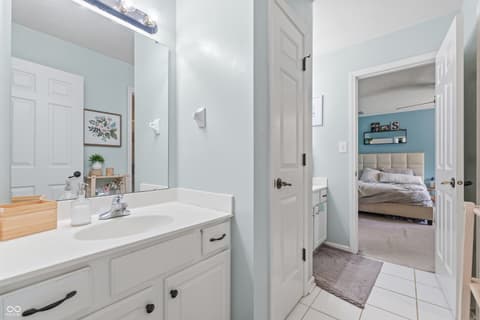 Primary bathroom at 13221 Griffin Run, Carmel, IN — Bright, updated primary bath with spacious vanity.