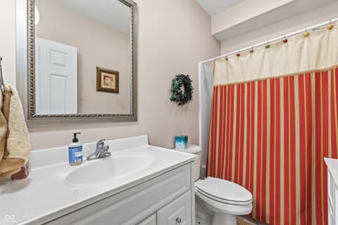 Bathroom at 13221 Griffin Run, Carmel, IN — Clean, well-maintained bathroom with classic styling.