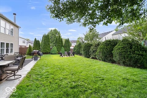 Yard at 12667 Courage Crossing, Fishers, IN — Large, manicured yard with mature landscaping and privacy.