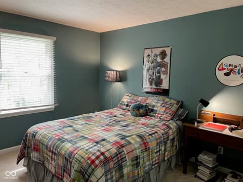 Bedroom at 3155 Jason Street, Carmel, IN — Freshly painted bedroom with modern sage green accent walls.