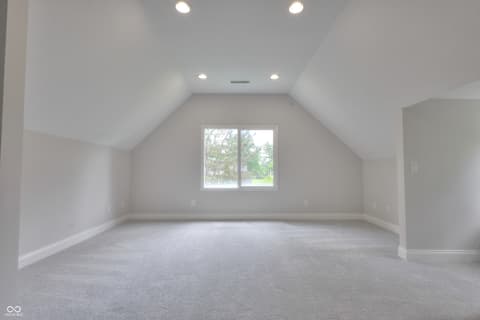 Bonus room at 11005 Cornell Street, Carmel, IN — Spacious bonus room with vaulted ceilings and natural light.
