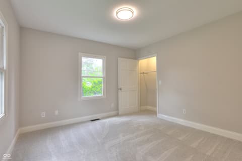 Bedroom at 11005 Cornell Street, Carmel, IN — Bright bedroom with large windows and fresh updates.