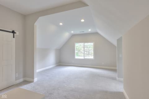 Bonus room at 11005 Cornell Street, Carmel, IN — Bright bonus room with vaulted ceilings and natural light.