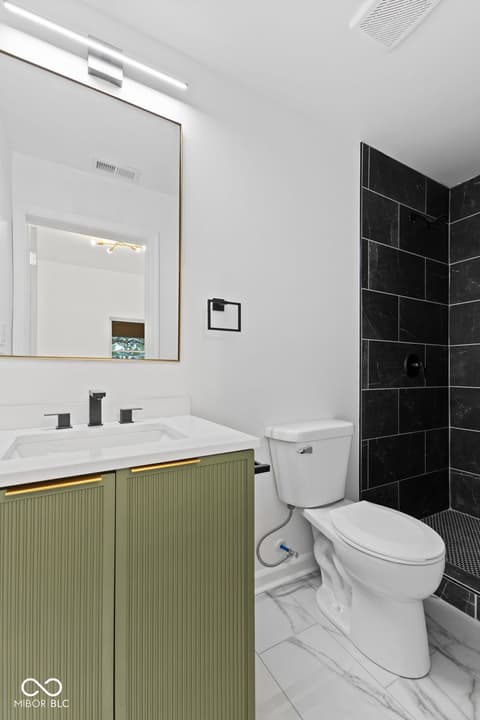 Primary bathroom at 1335 Christian Avenue, Noblesville, IN — Modern primary bath with sleek black tile shower.