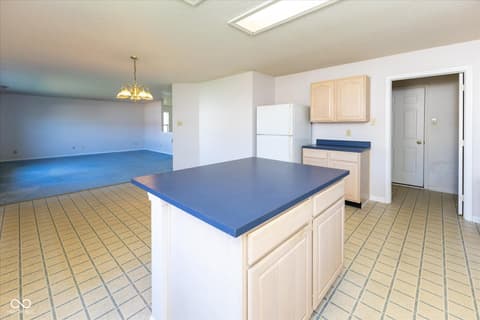 Kitchen at 10288 Brushfield Lane, Fishers, IN — Spacious kitchen with island and open layout.