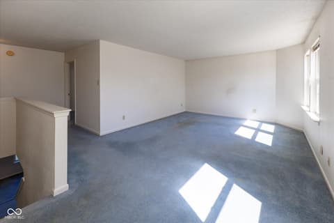 Living room at 10288 Brushfield Lane, Fishers, IN — Spacious open living area with abundant natural light.