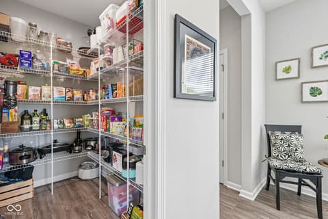 Laundry room at 18757 Dooney Court, Noblesville, IN — Spacious walk-in pantry with excellent organization systems.