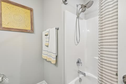 Bathroom at 18757 Dooney Court, Noblesville, IN — Modern bathroom with dual showerheads and clean finishes.
