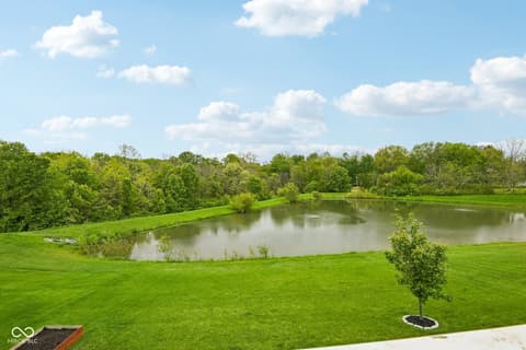 Yard at 18757 Dooney Court, Noblesville, IN — Expansive private grounds with scenic pond views.