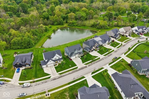Aerial view at 18757 Dooney Court, Noblesville, IN — Exclusive waterfront community with pristine pond views.