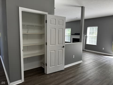 Family room at 13563 Guy Street, Fishers, IN — Spacious family room with built-in storage and fireplace.